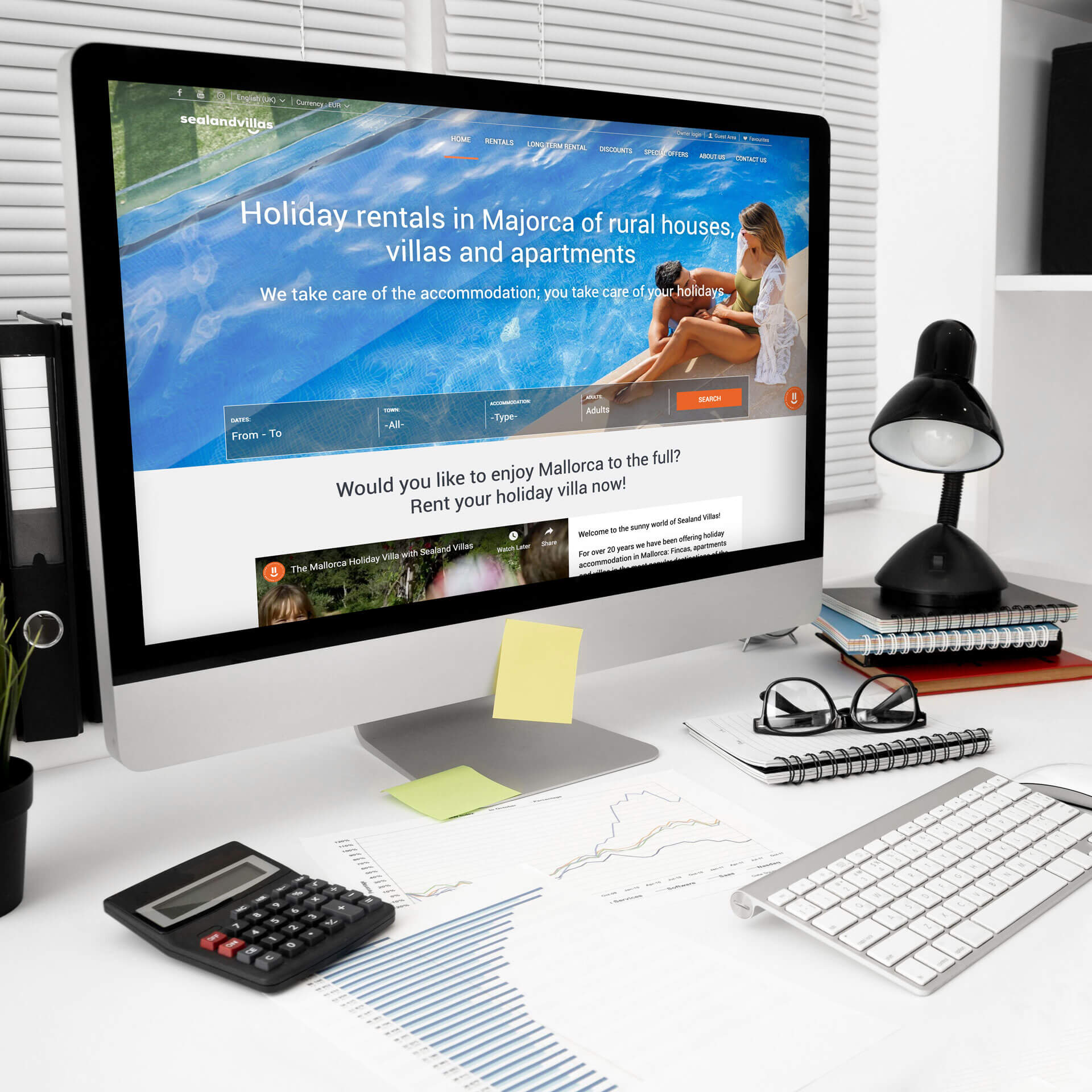 Desktop computer shown on an organised office desk, representing professional holiday property management and online booking services.